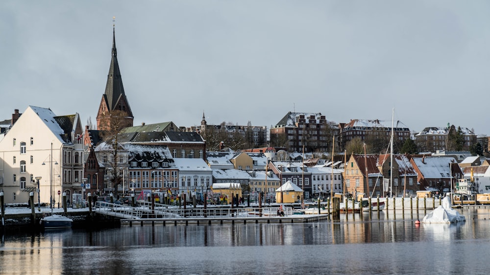 a harbor filled with lots of snow covered buildings