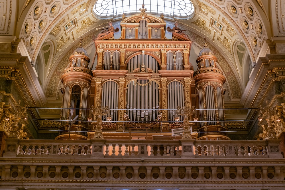 a large pipe organ in a church with a skylight