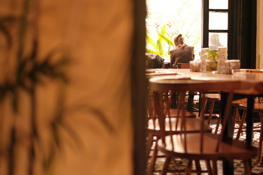 a person sitting at a table in a restaurant