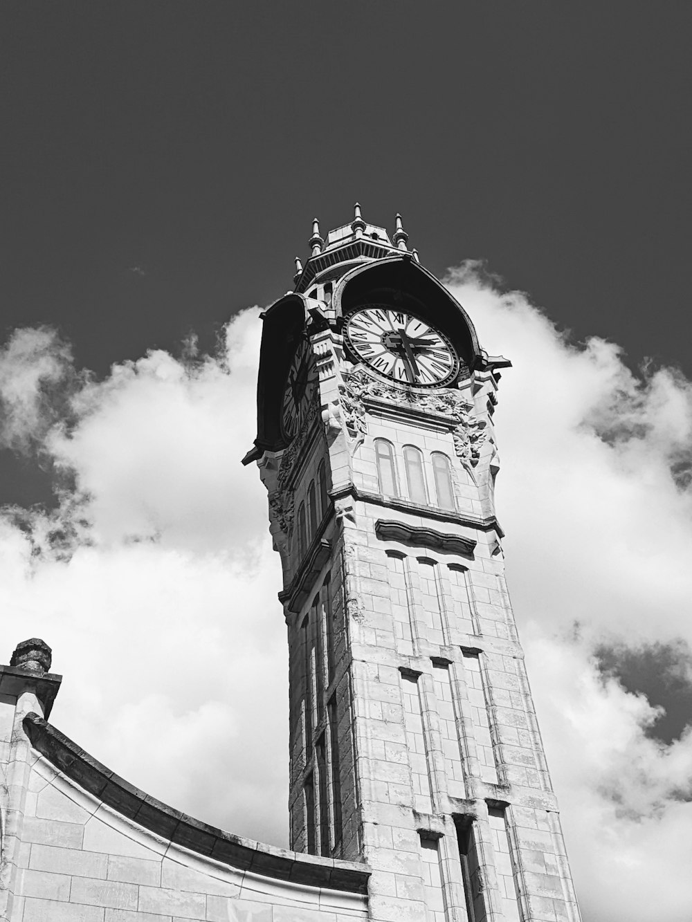 a black and white photo of a clock tower