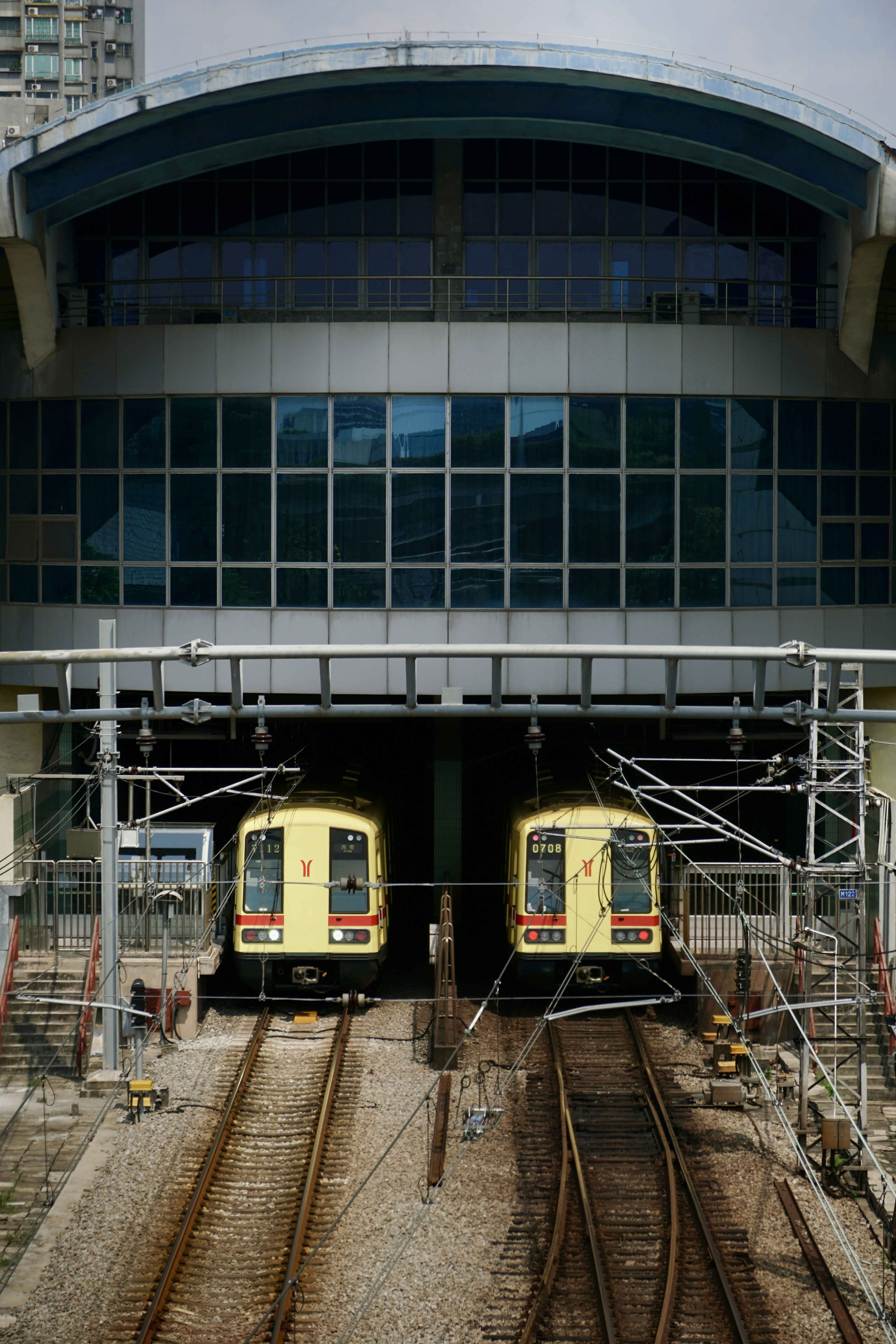 A couple of trains that are sitting on the tracks photo – Free Building ...