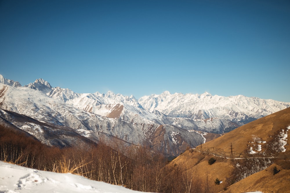 a view of a snowy mountain range from a ski slope