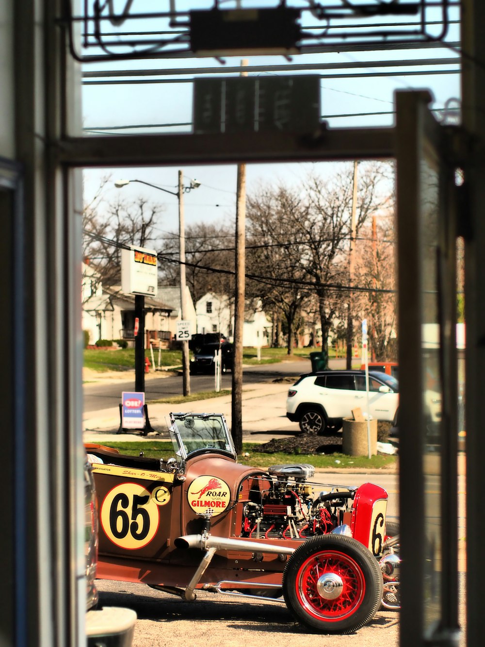 an old model t car is parked on the side of the road