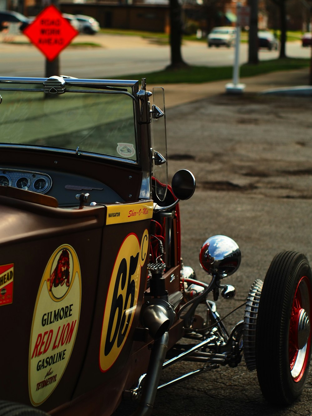 an old model t car is parked on the side of the road