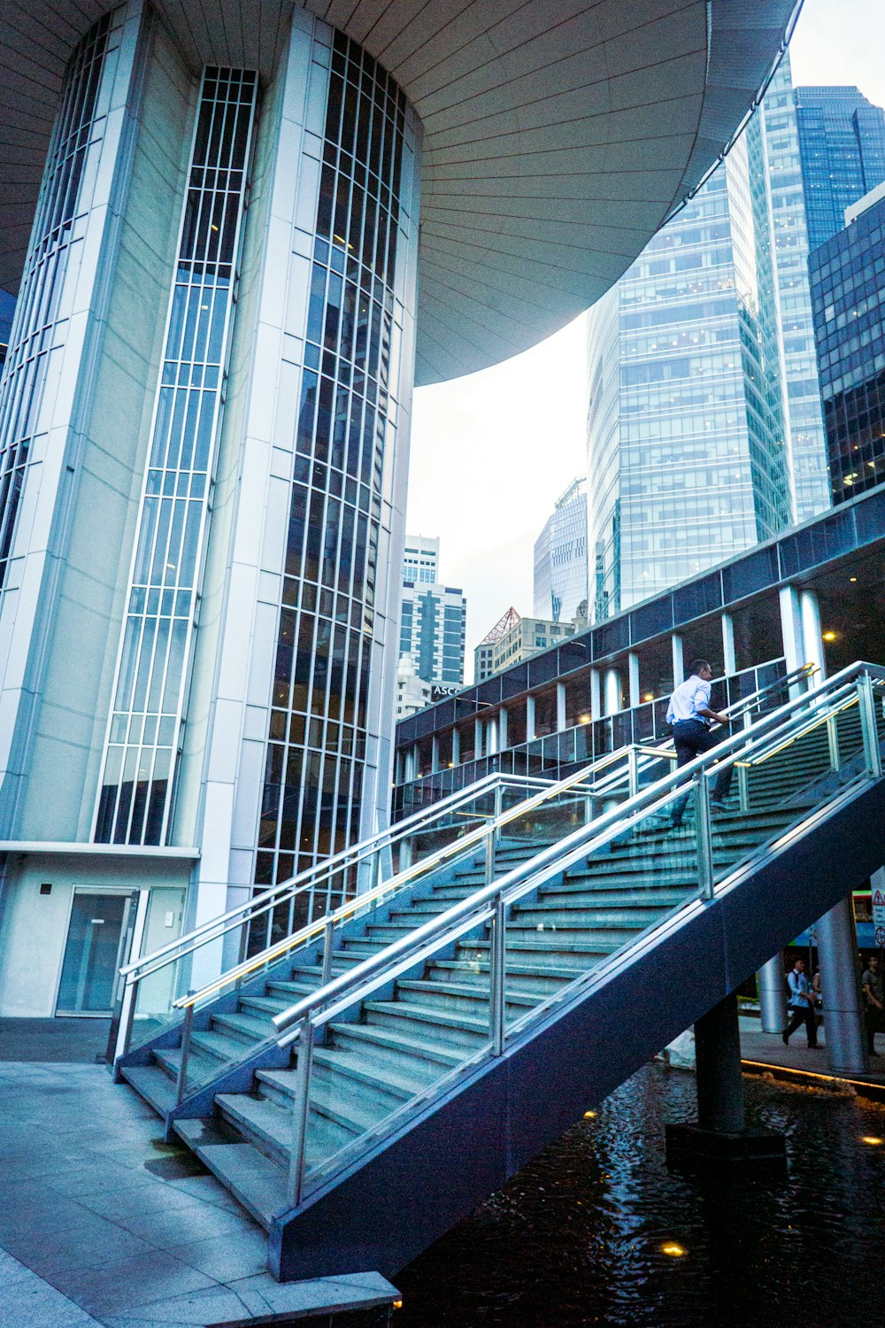 a man riding a skateboard down a metal handrail