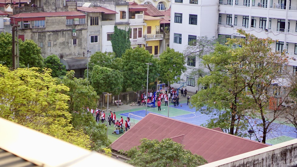 a group of people standing on top of a tennis court