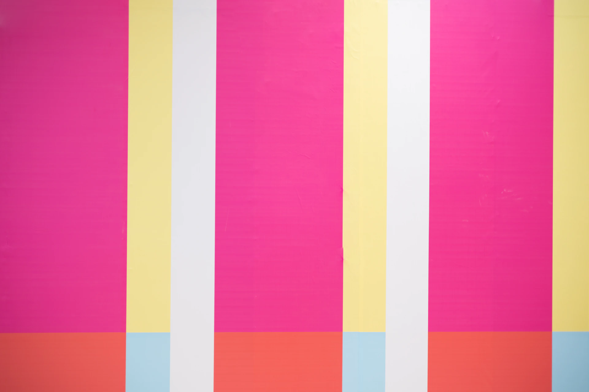 a painting of multicolored stripes on a wall