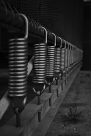a row of coils on the side of a building