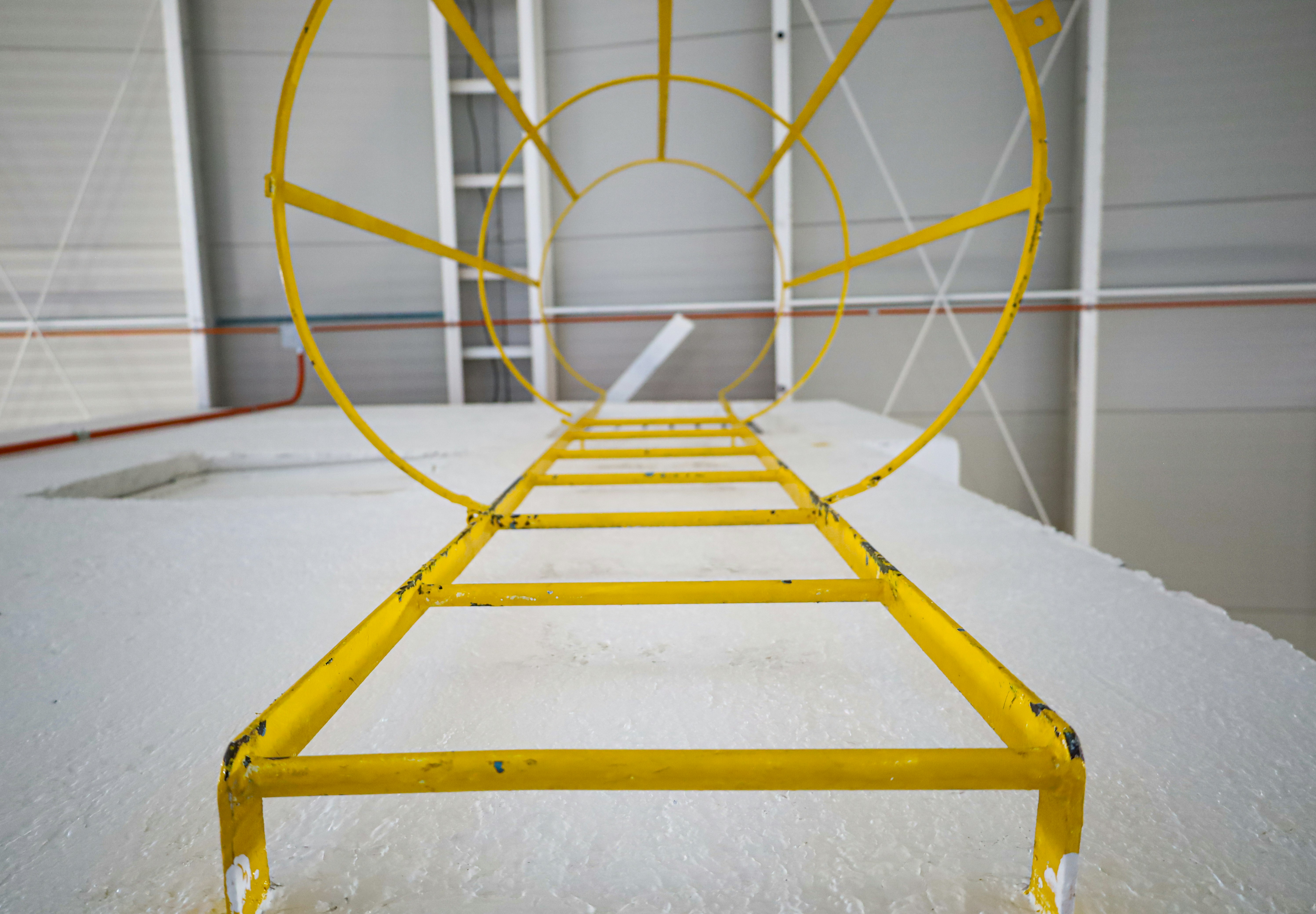 Industrial safety harness equipment on bright white background, clean airy studio