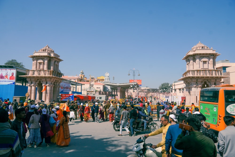 a crowd of people standing around a street