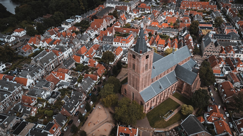 an aerial view of a city with red roofs