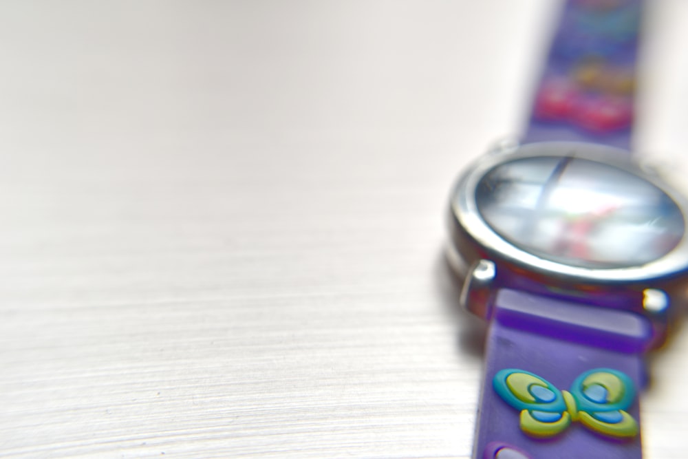 a close up of a watch on a table