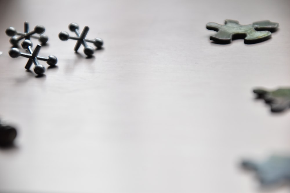 a group of small pieces of metal sitting on top of a table