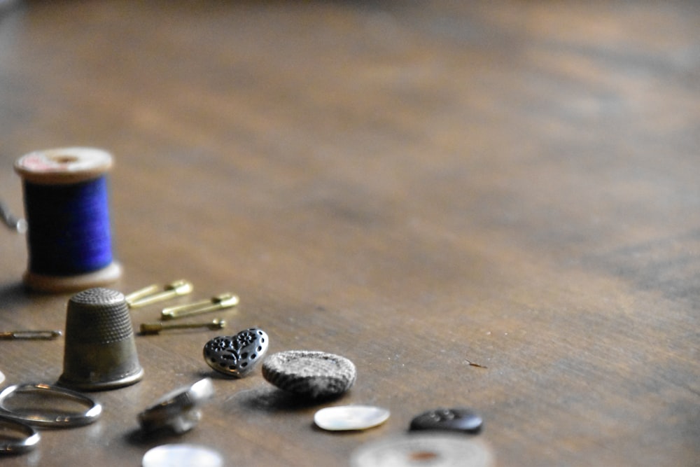 a table topped with lots of different types of sewing supplies