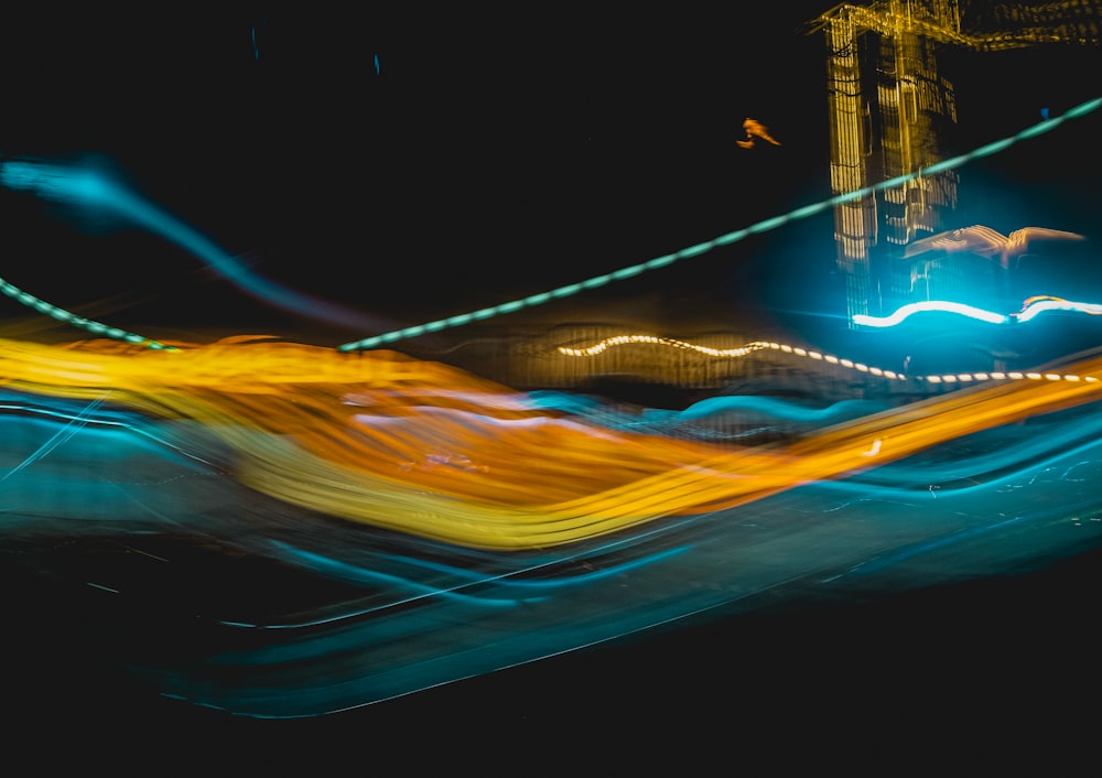 a blurry photo of a clock tower at night