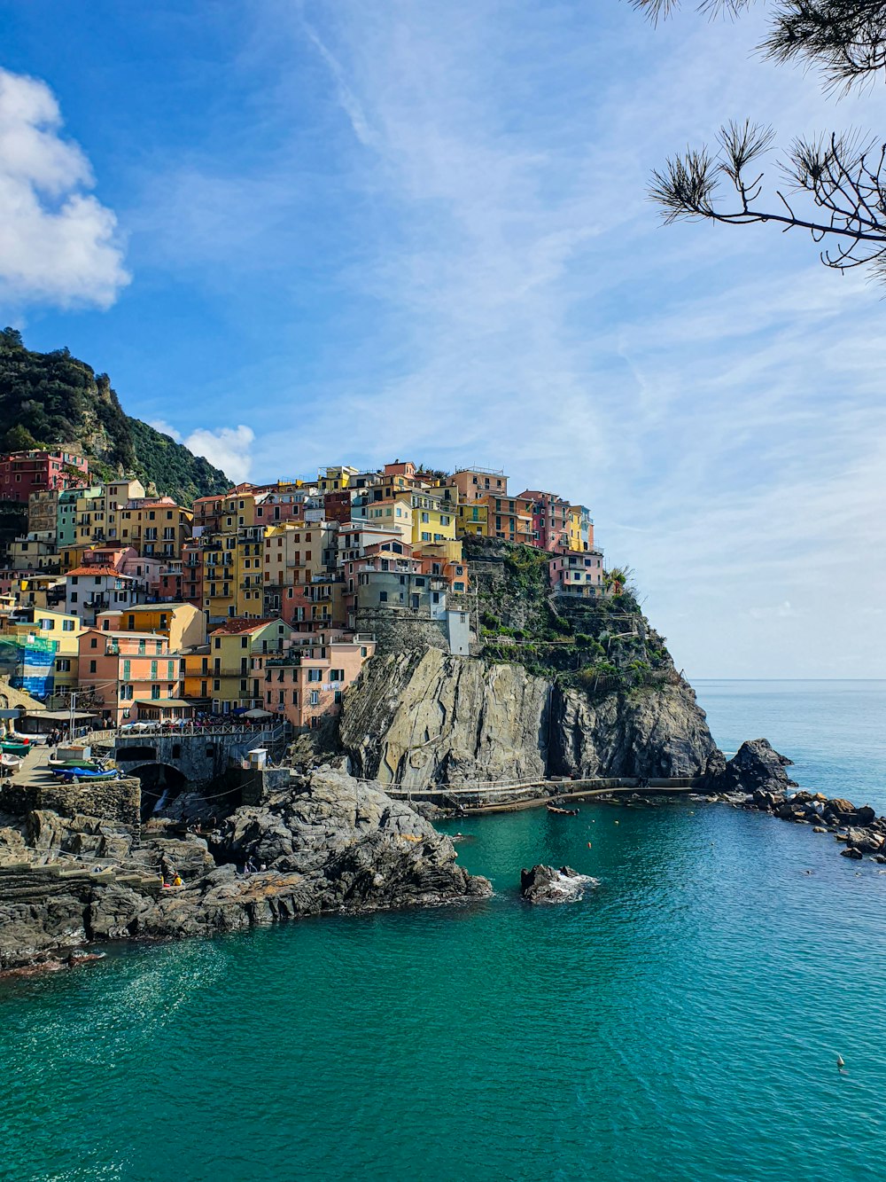 a small village on a cliff overlooking the ocean