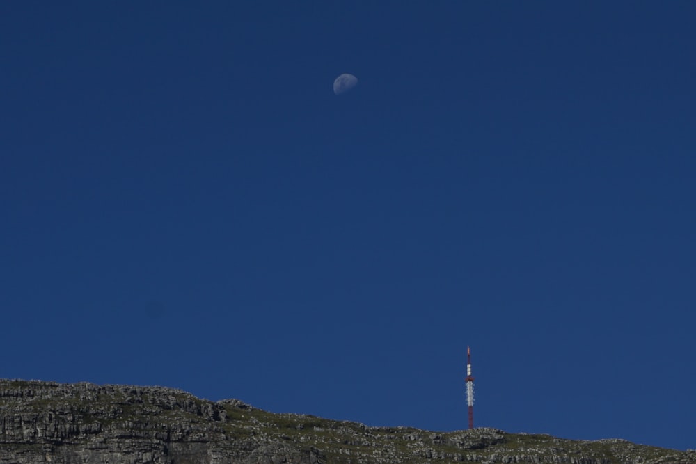 a very tall hill with a very tall tower on top of it