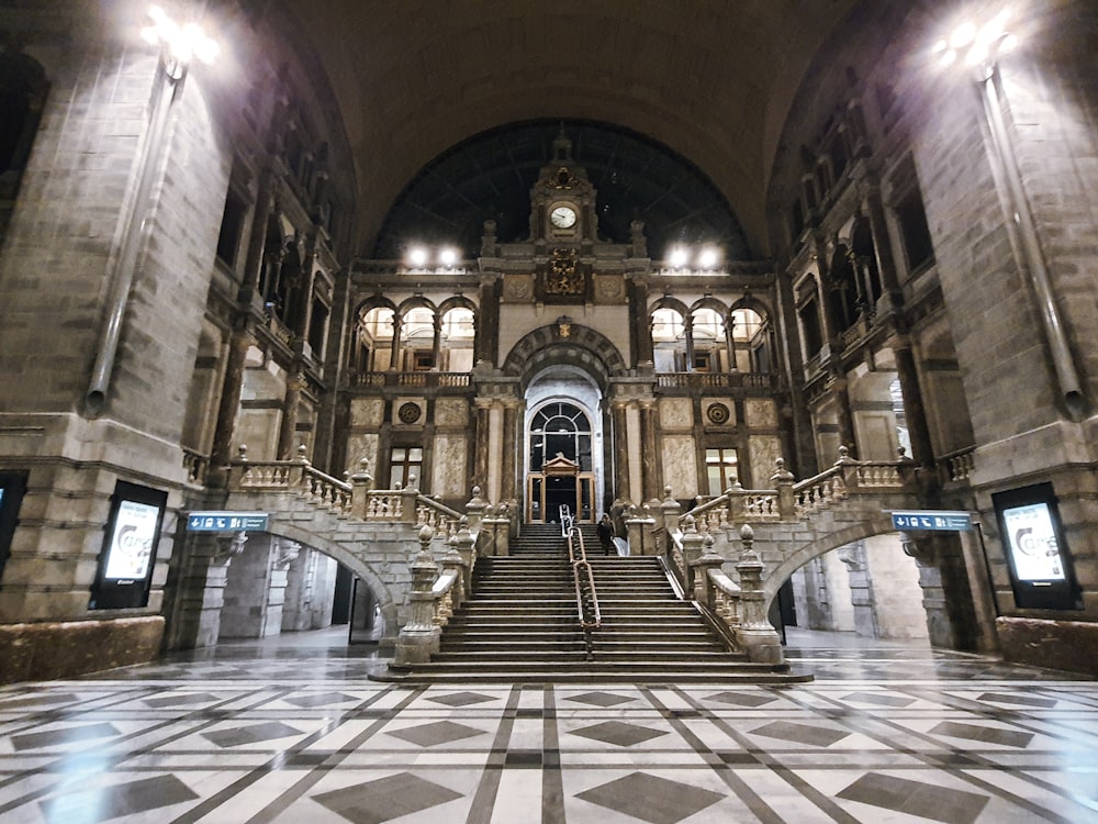 a large building with a staircase and a clock