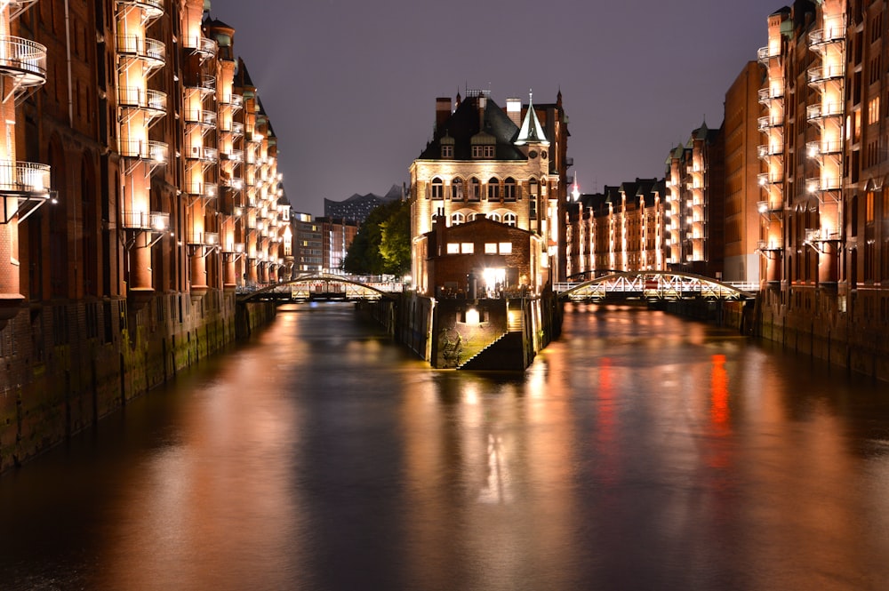 a river running through a city next to tall buildings