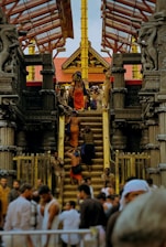 a group of people walking up and down a set of stairs