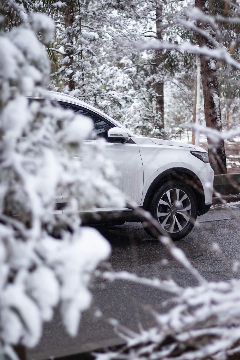 SUV on a snowy road, representing seasonal vehicle care