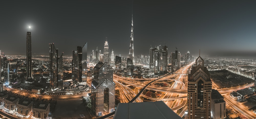 a view of a city at night from the top of a building