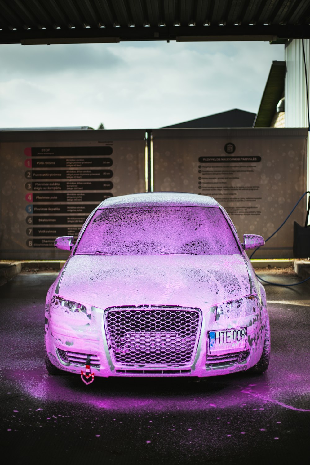 a purple car parked in a parking lot