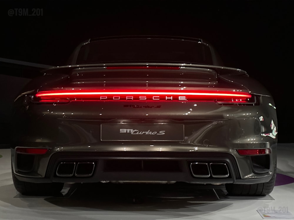 the rear end of a porsche car on display