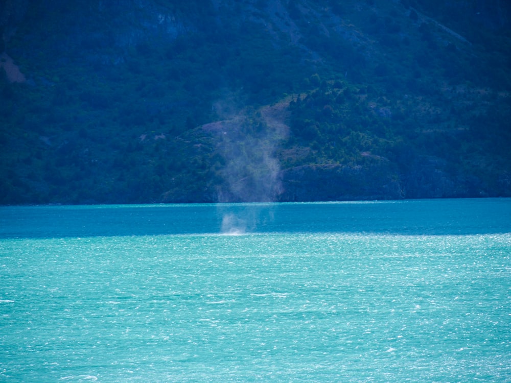 a boat floating on top of a large body of water