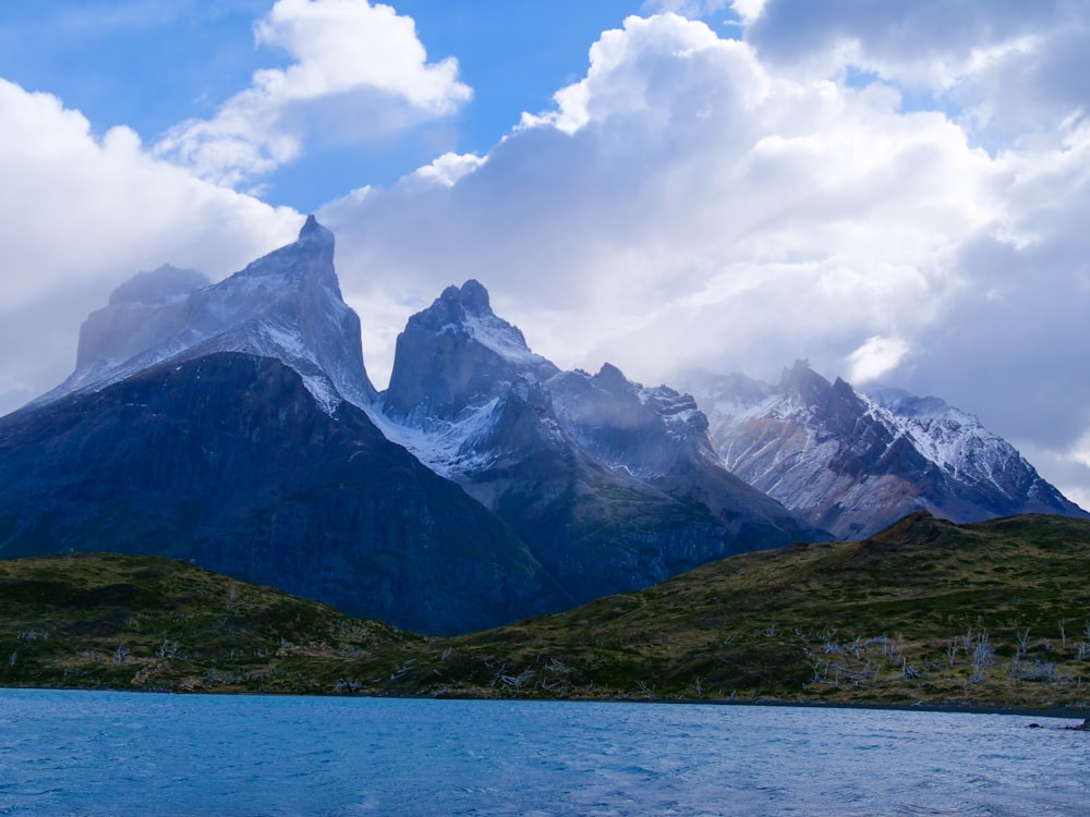 a mountain range with a body of water in front of it