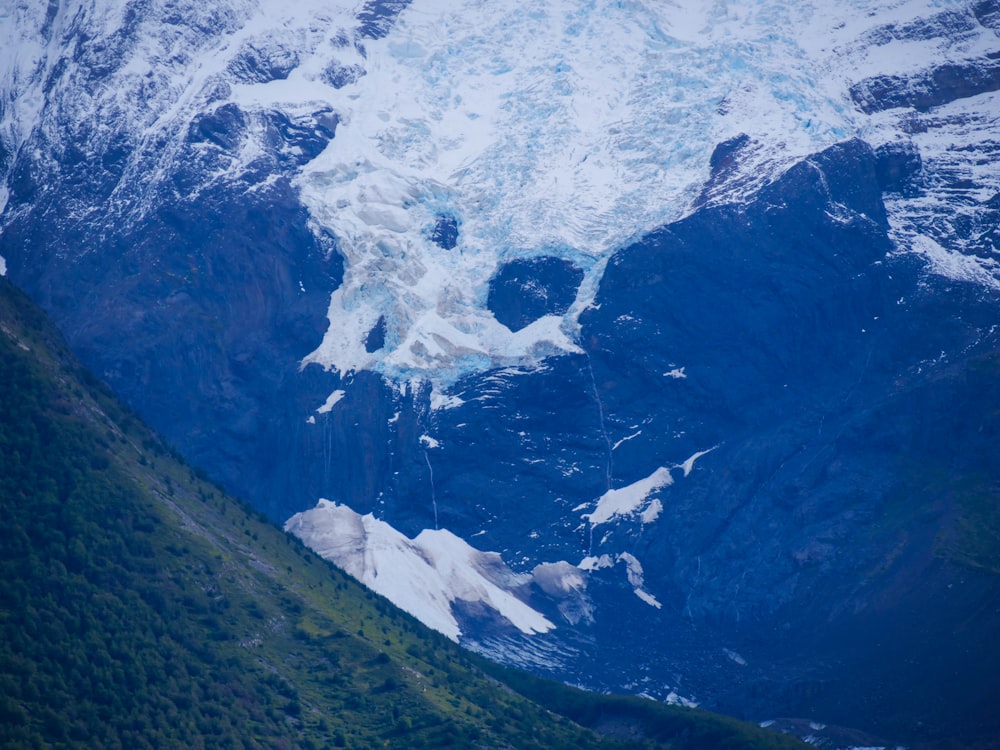 a view of a mountain with snow on it