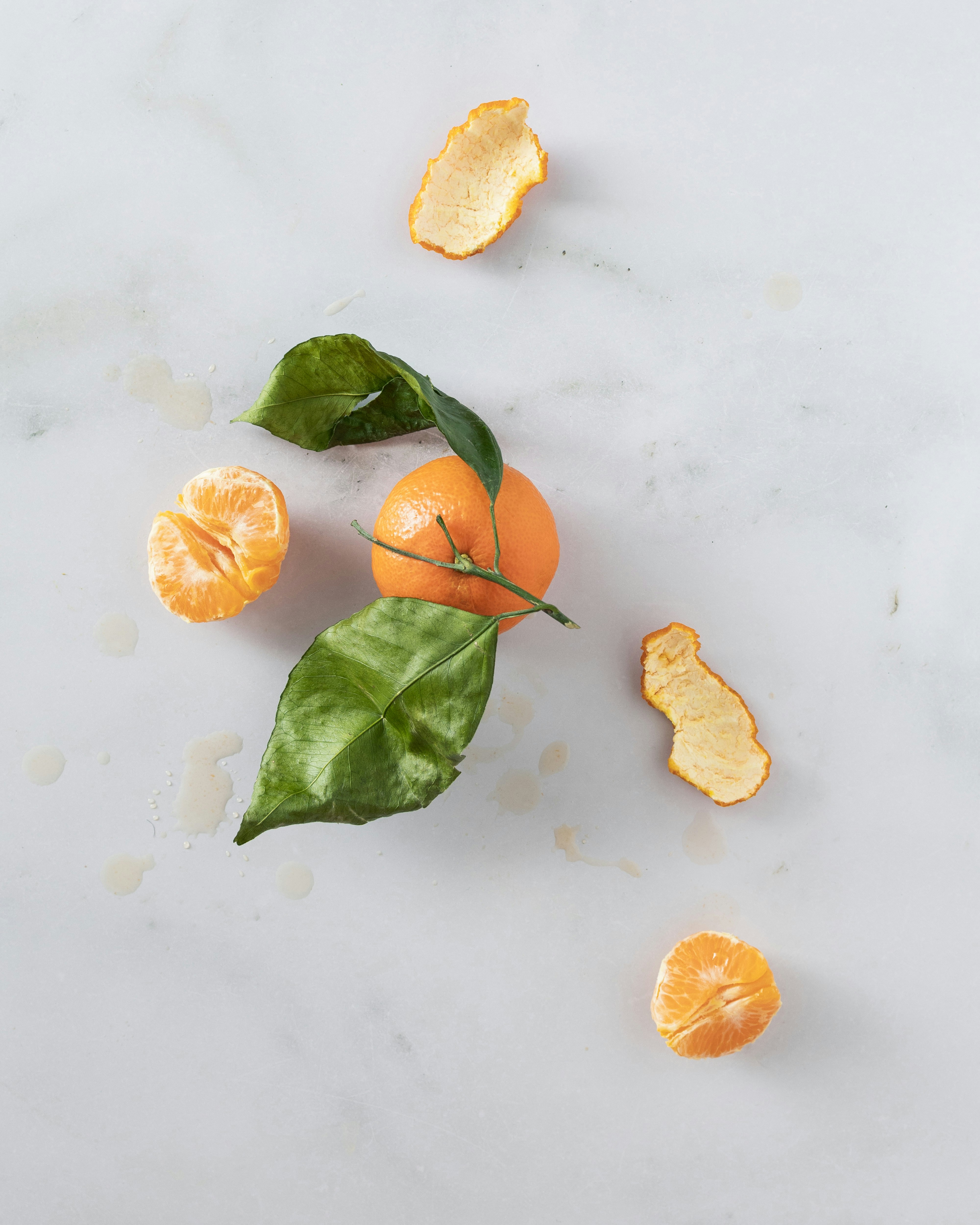 a group of oranges sitting on top of a white counter