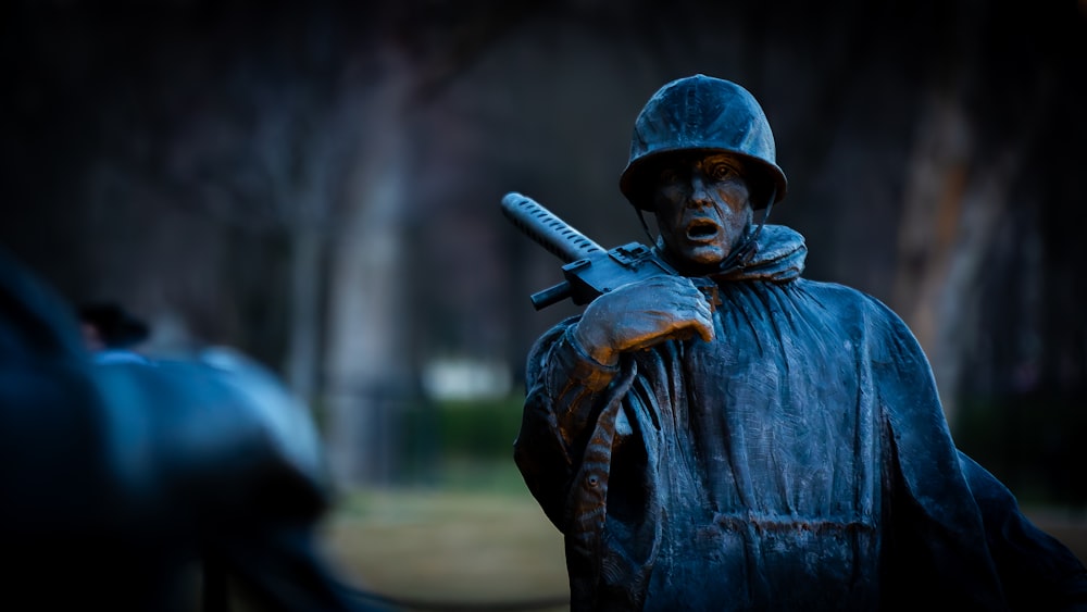 a statue of a soldier holding a gun
