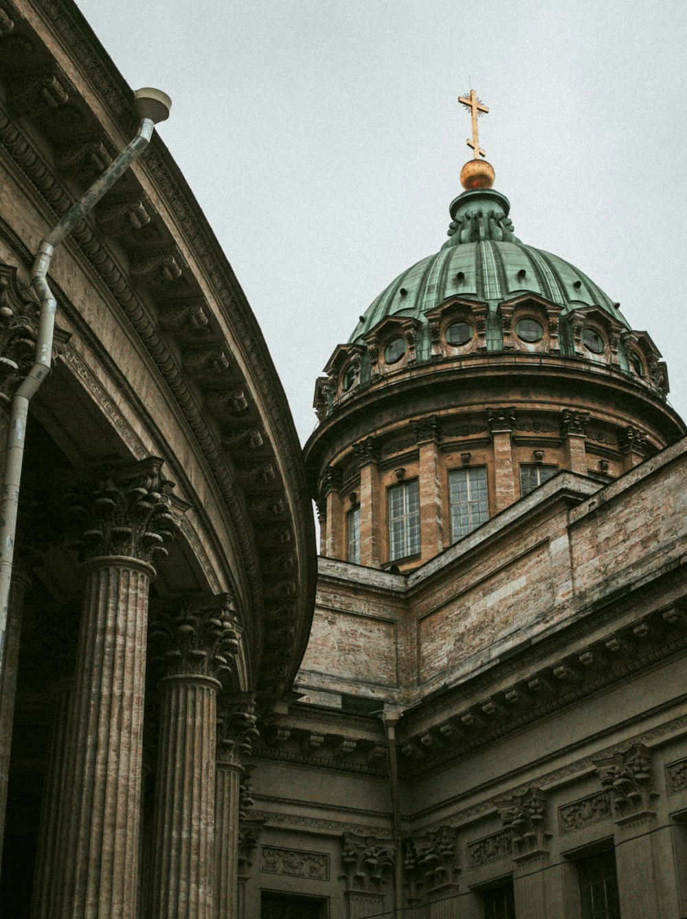 a large building with a cross on top of it