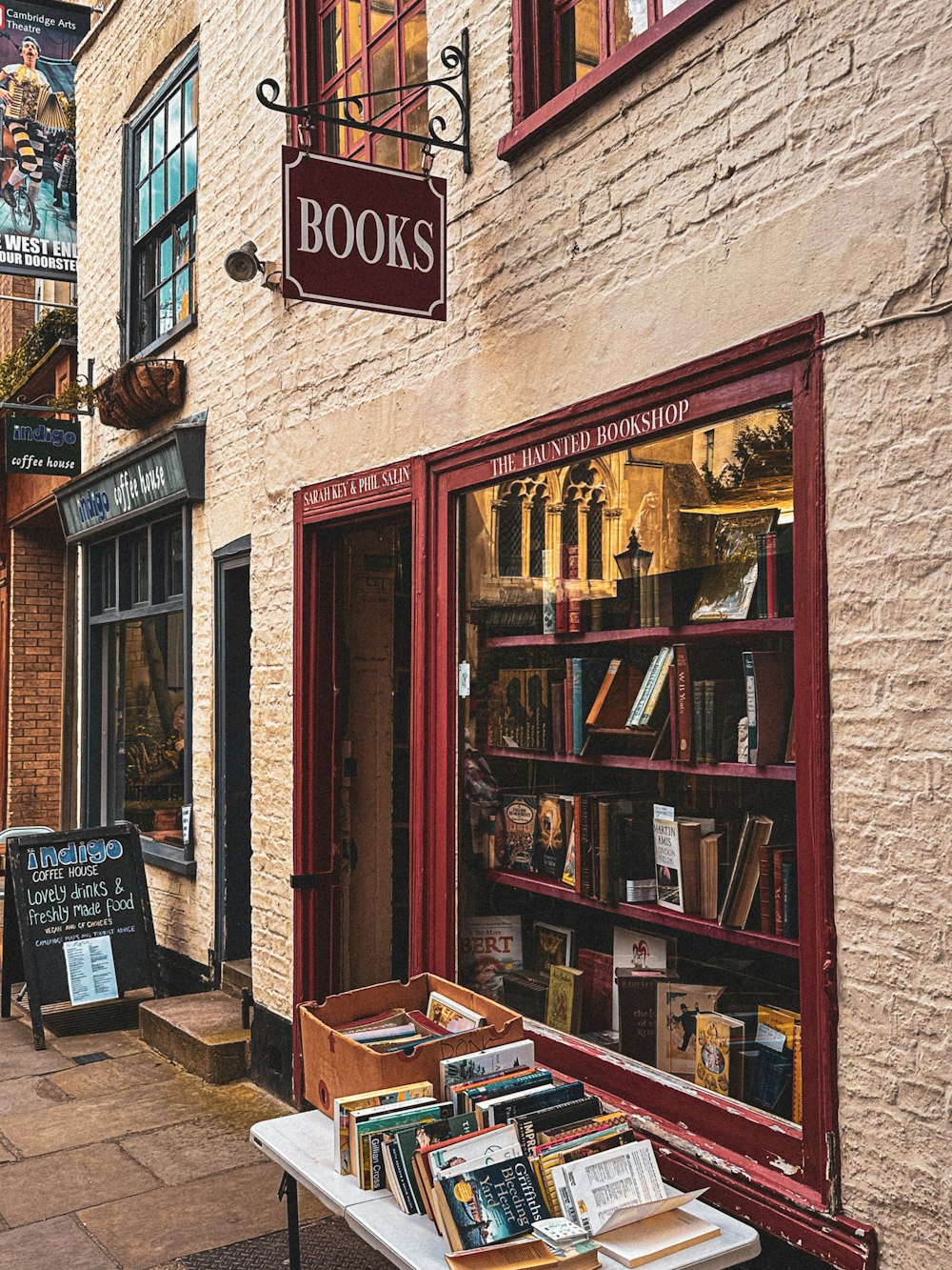 a book store on a street corner with books on display