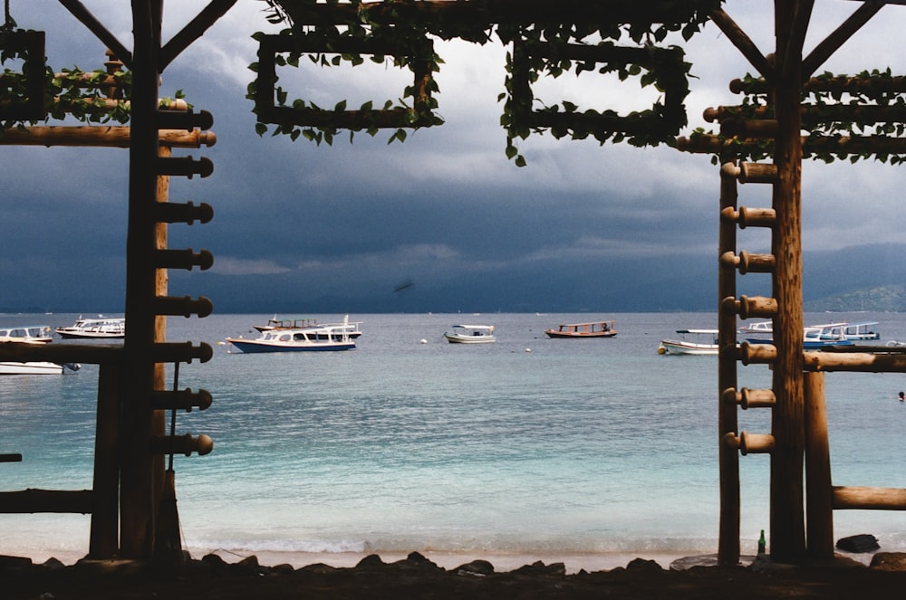 a view of a beach with boats in the water