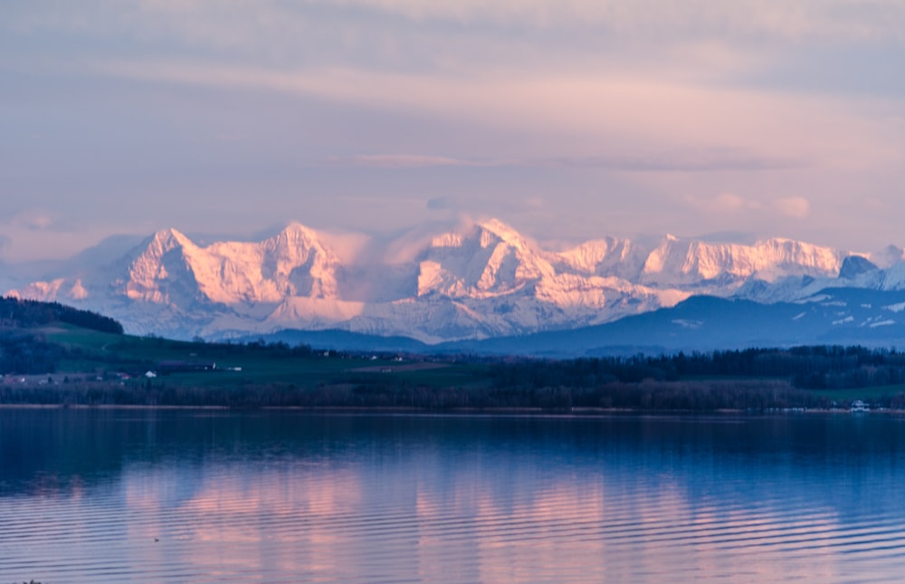 a lake with mountains in the background