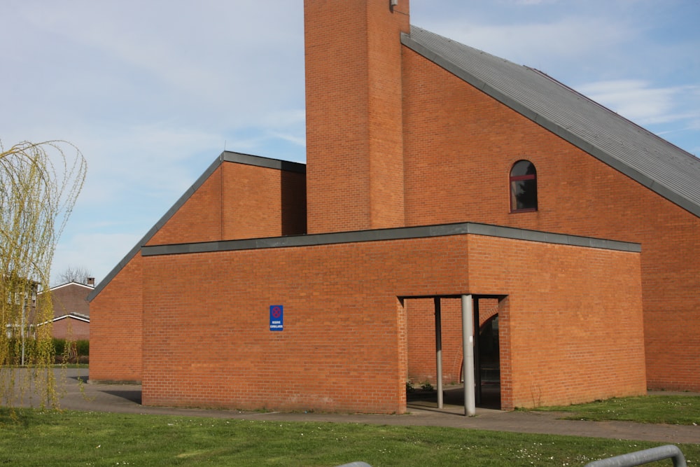 a large brick church with a tall steeple