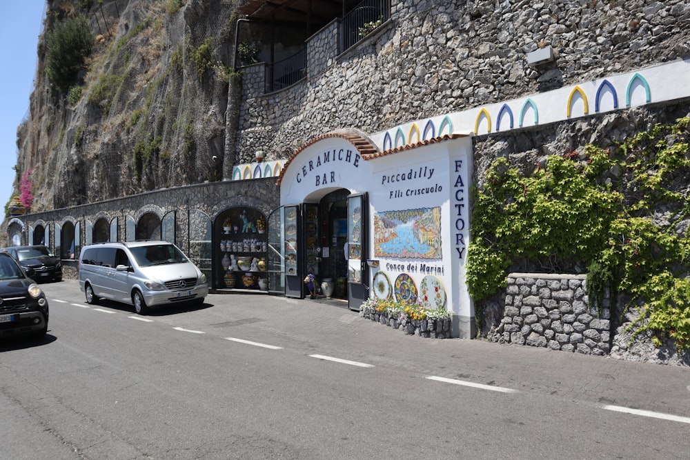 a car parked in front of a stone building