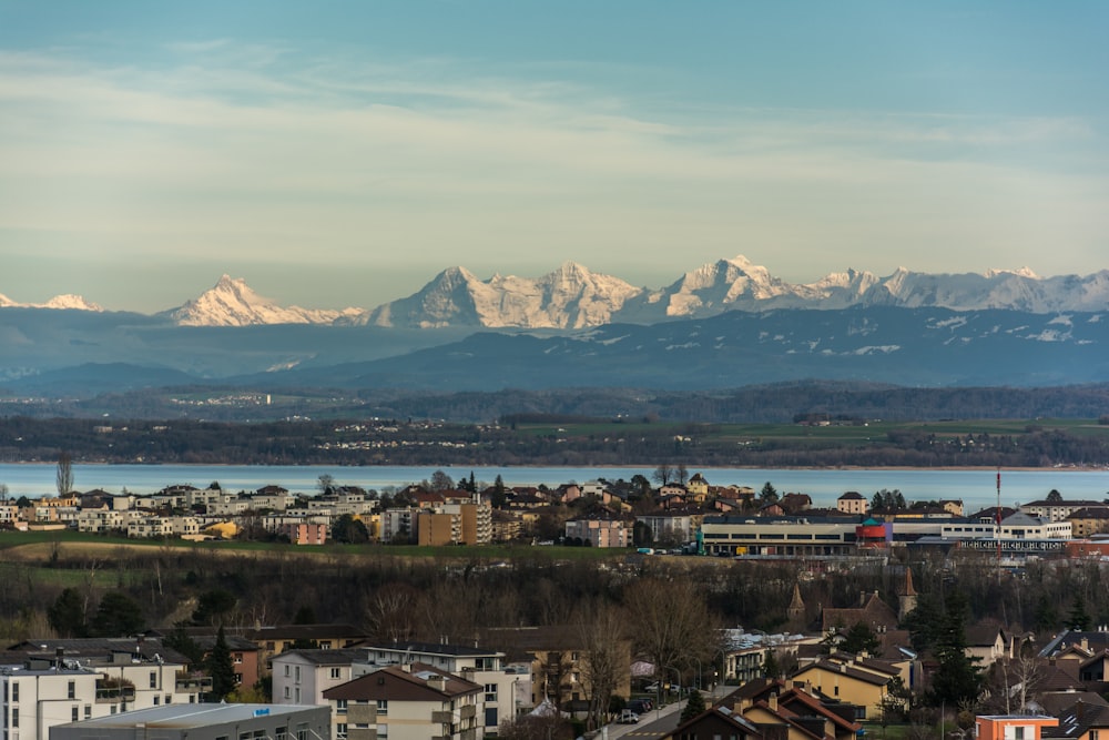 a view of a city with mountains in the background