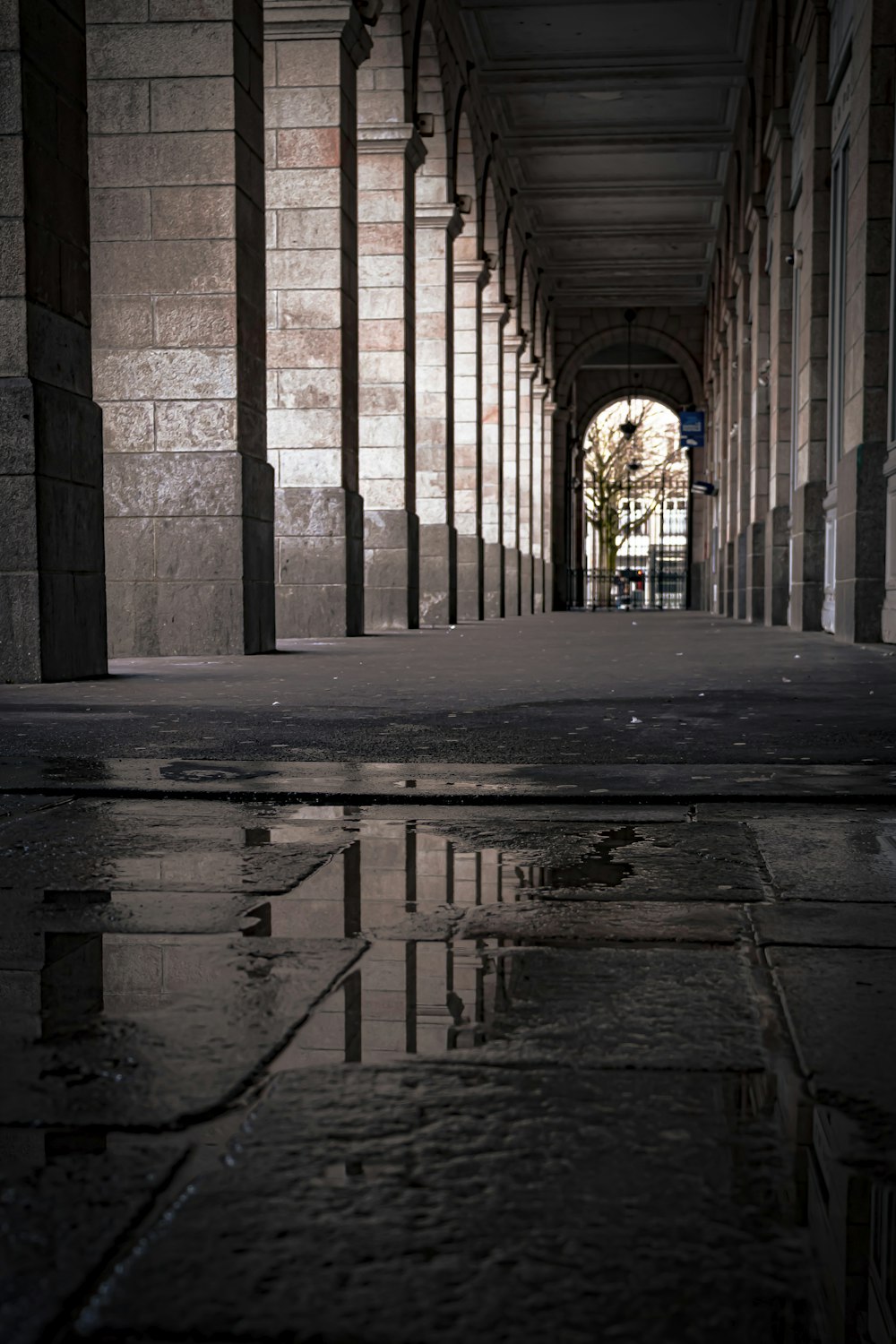 a long hallway with a clock on the side of it