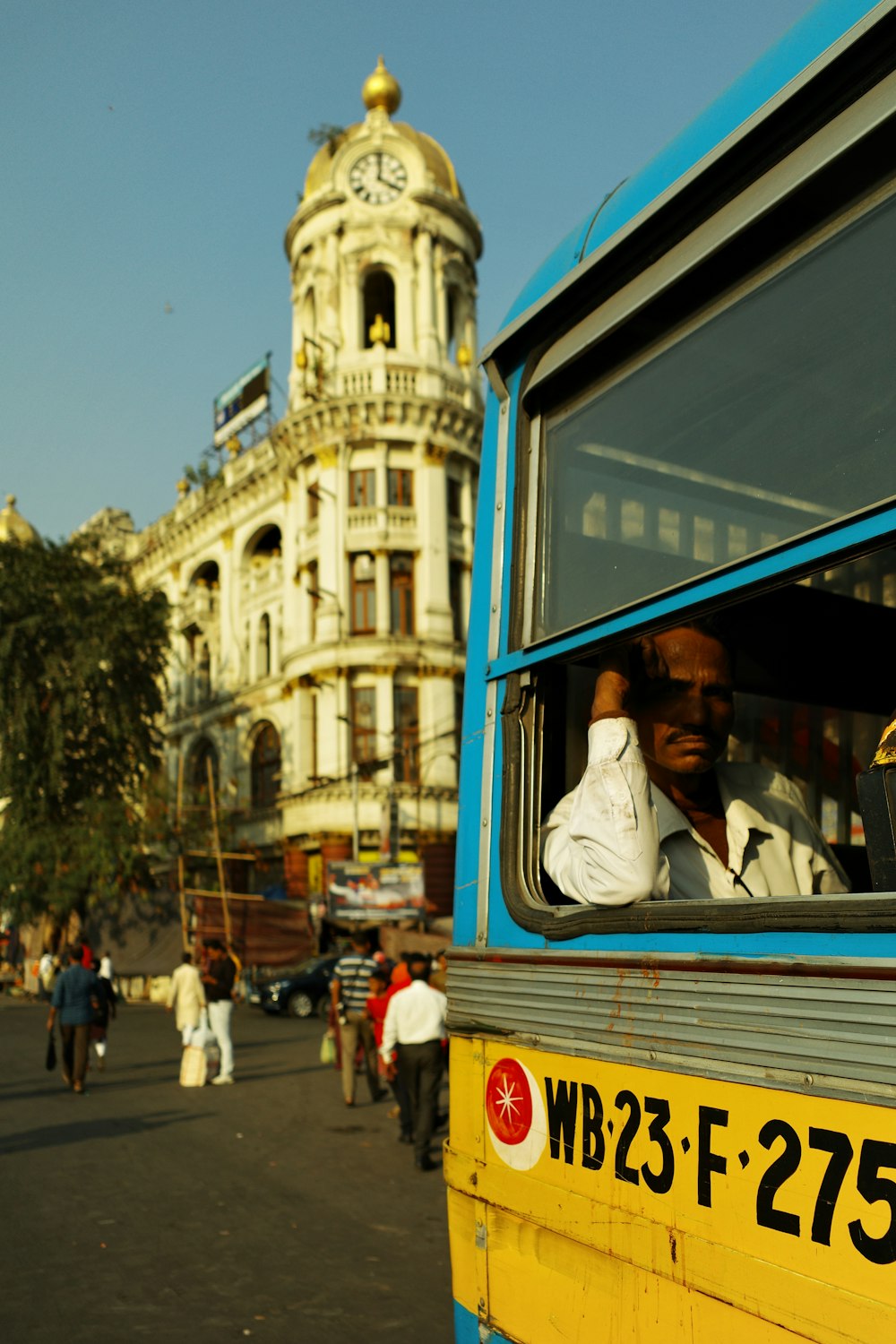 a man sitting in a bus looking out the window