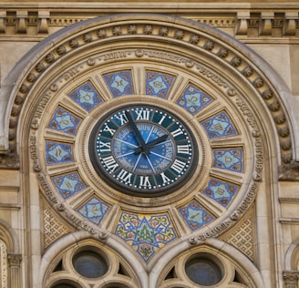a clock that is on the side of a building