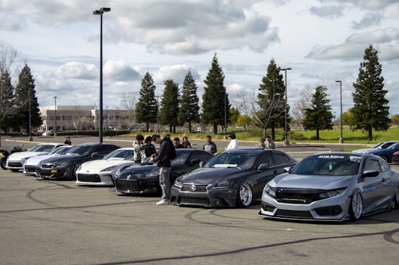 a group of cars parked in a parking lot