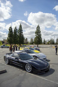 a group of cars parked in a parking lot