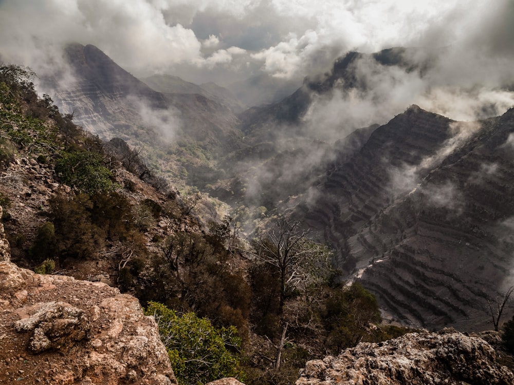 a view of a mountain range in the clouds