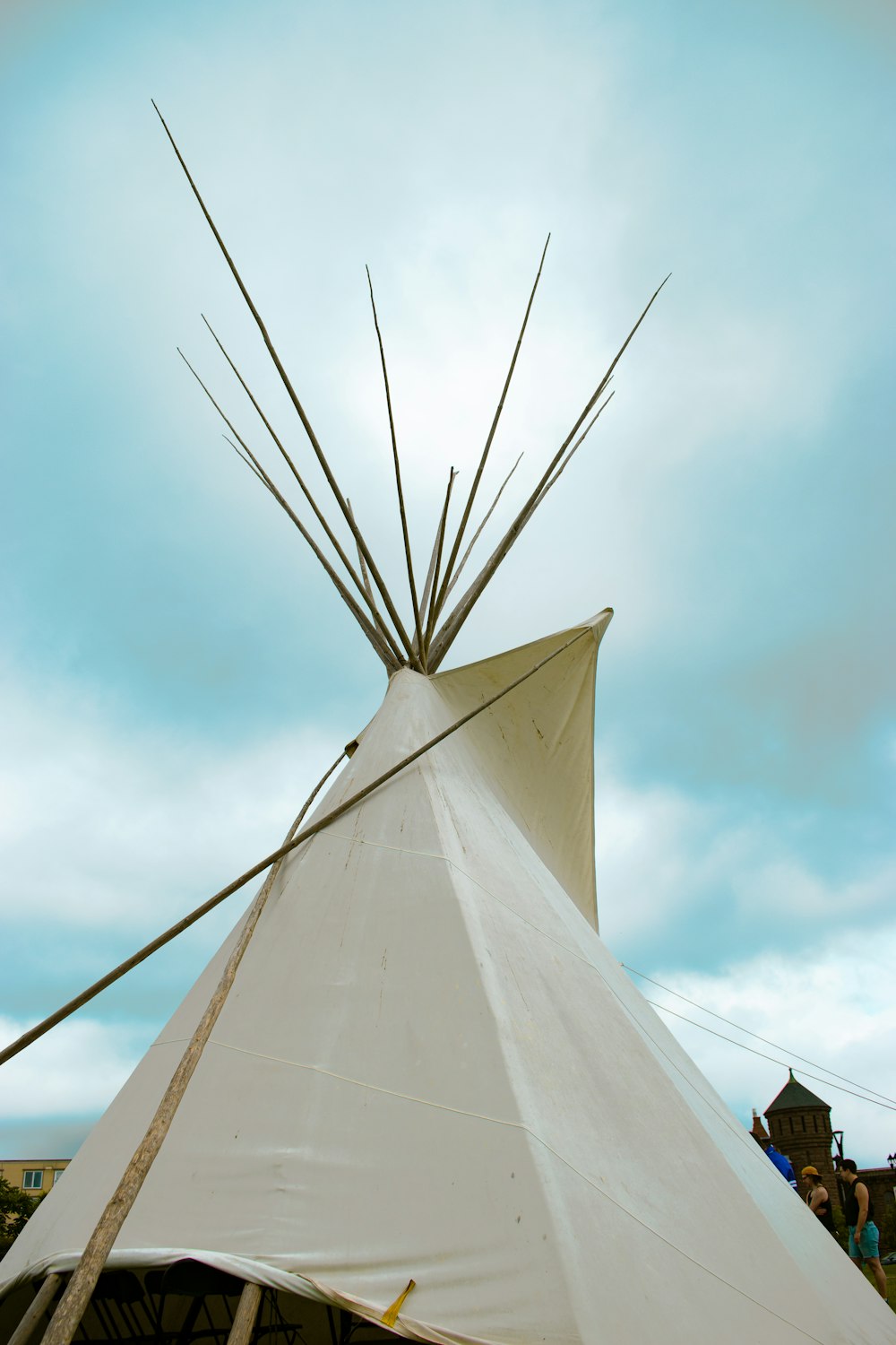 a teepee with sticks sticking out of it