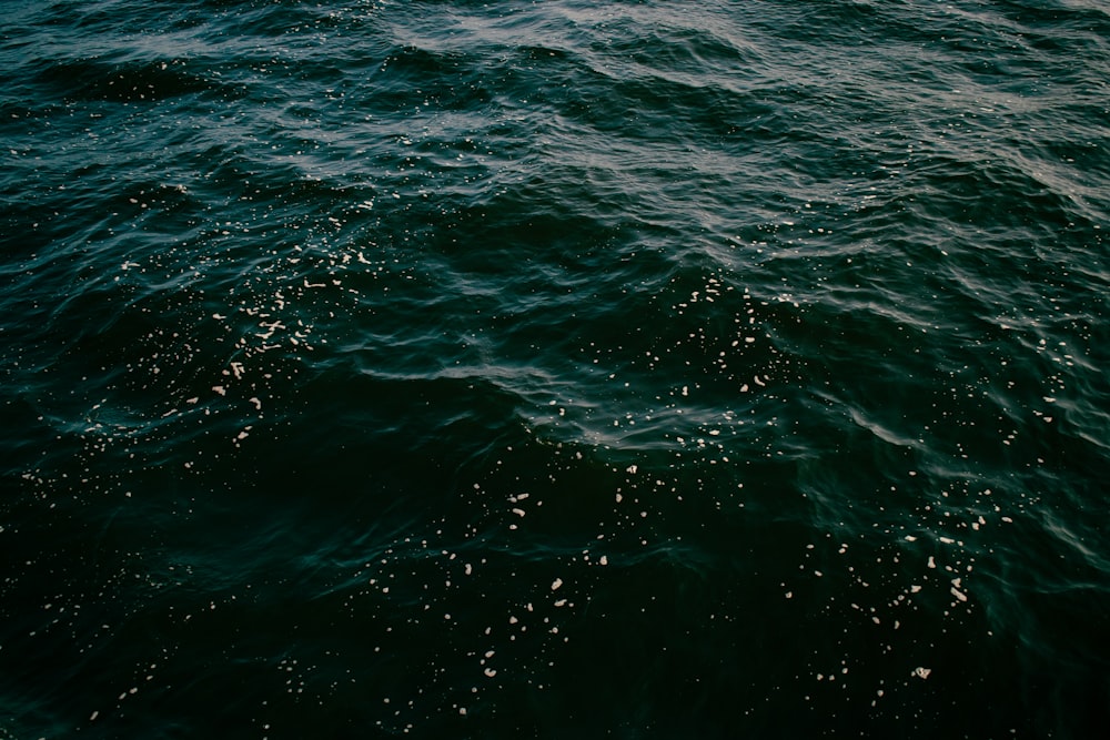 a body of water with a boat in the distance