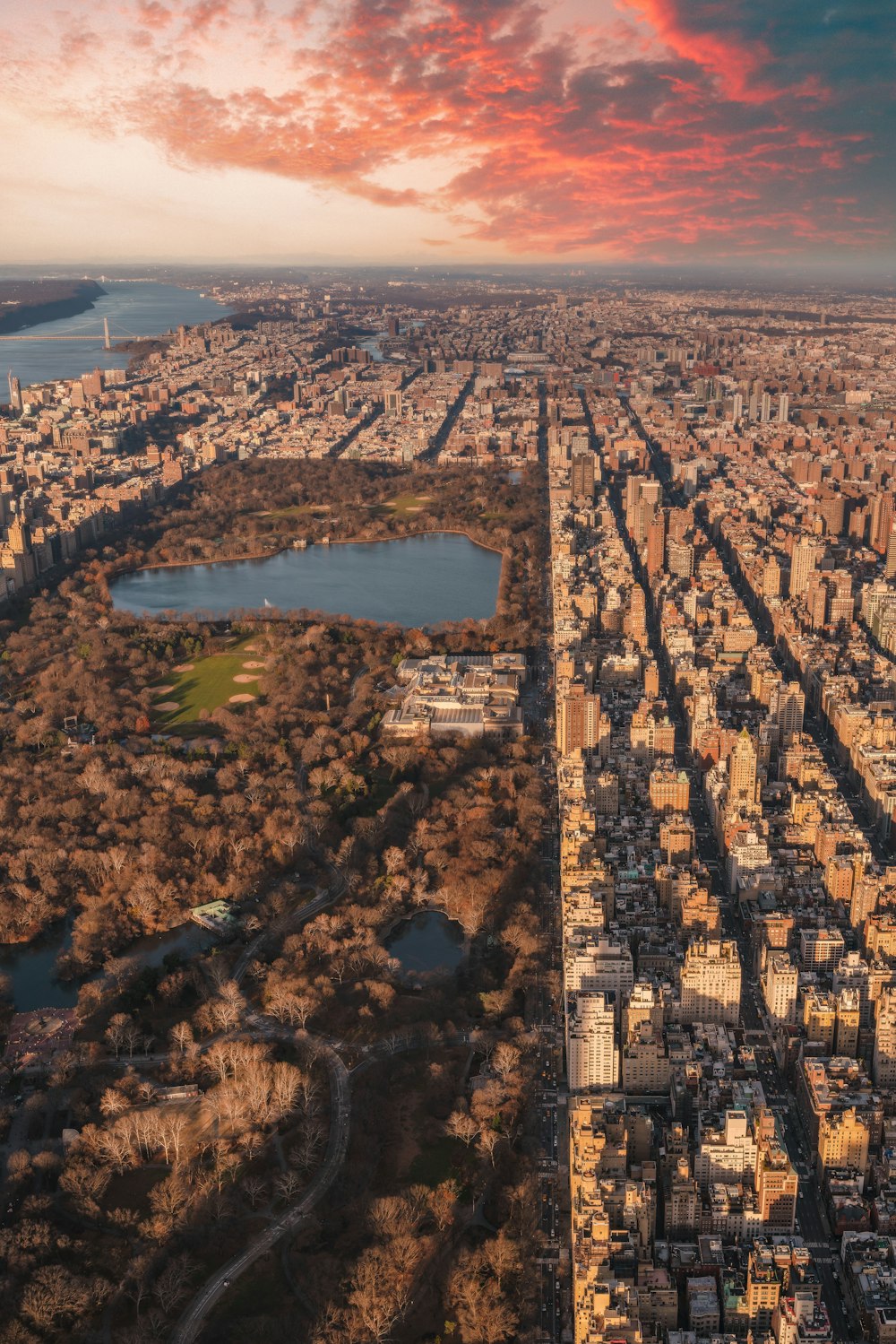 an aerial view of a city and a lake