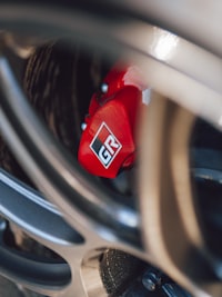 Apex pad installed — red caliper through wheel spoke